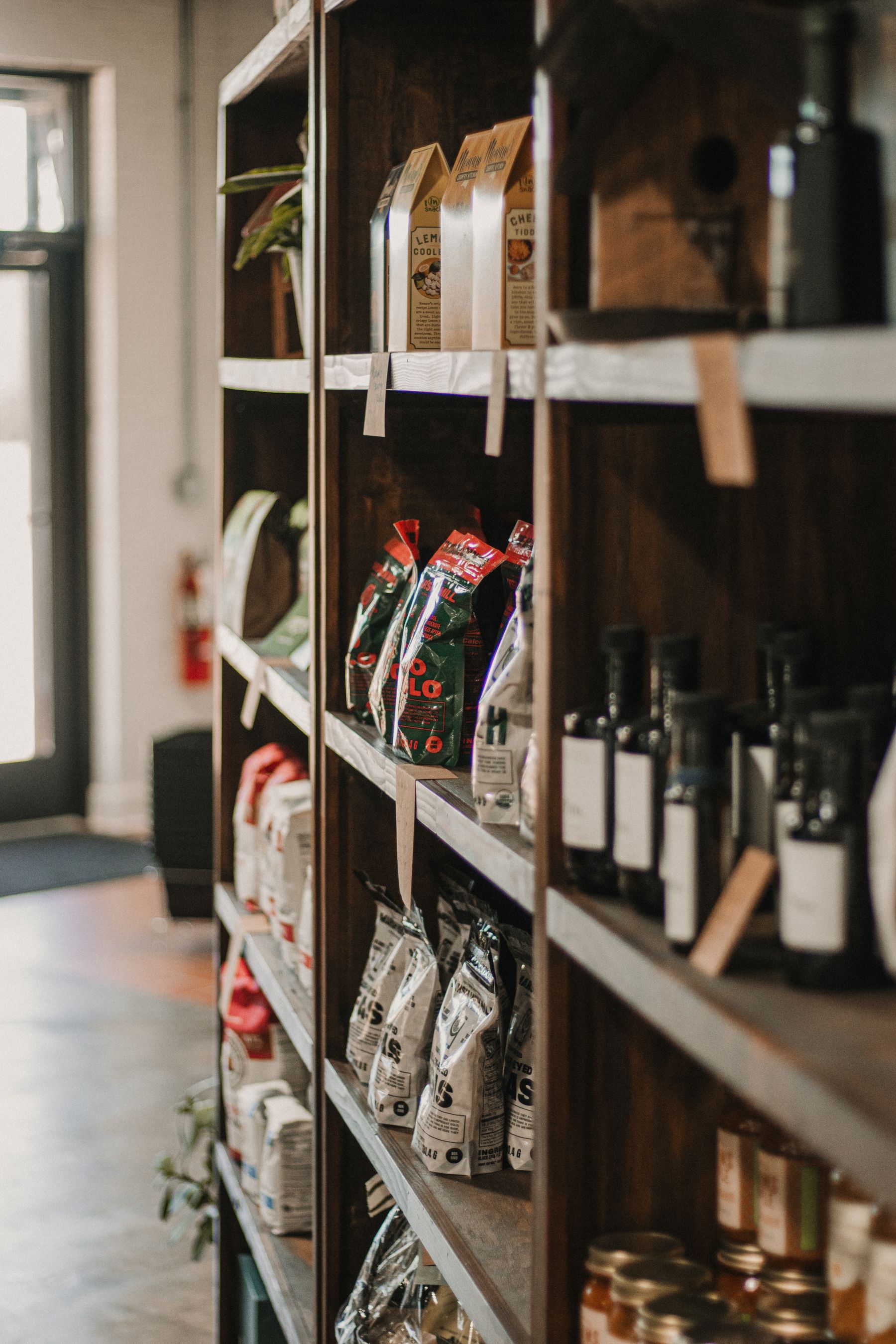 Everyday packaged products arranged on a neighborhood shop shelf