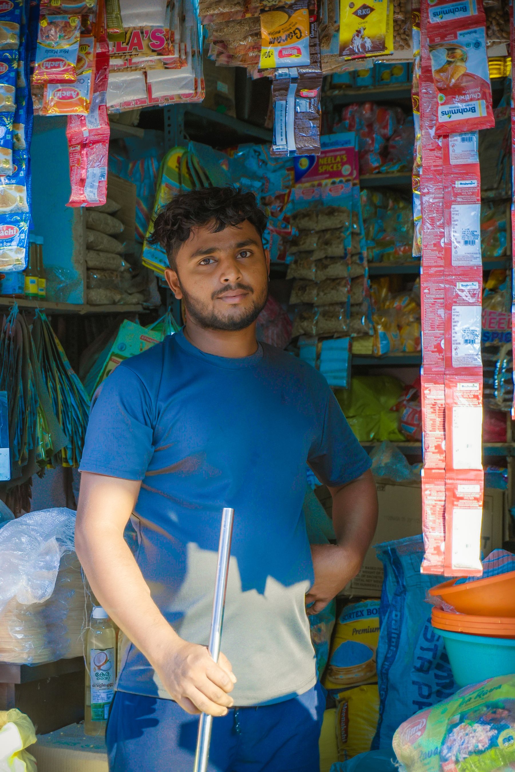 Independent shop owner standing among products in a neighborhood store